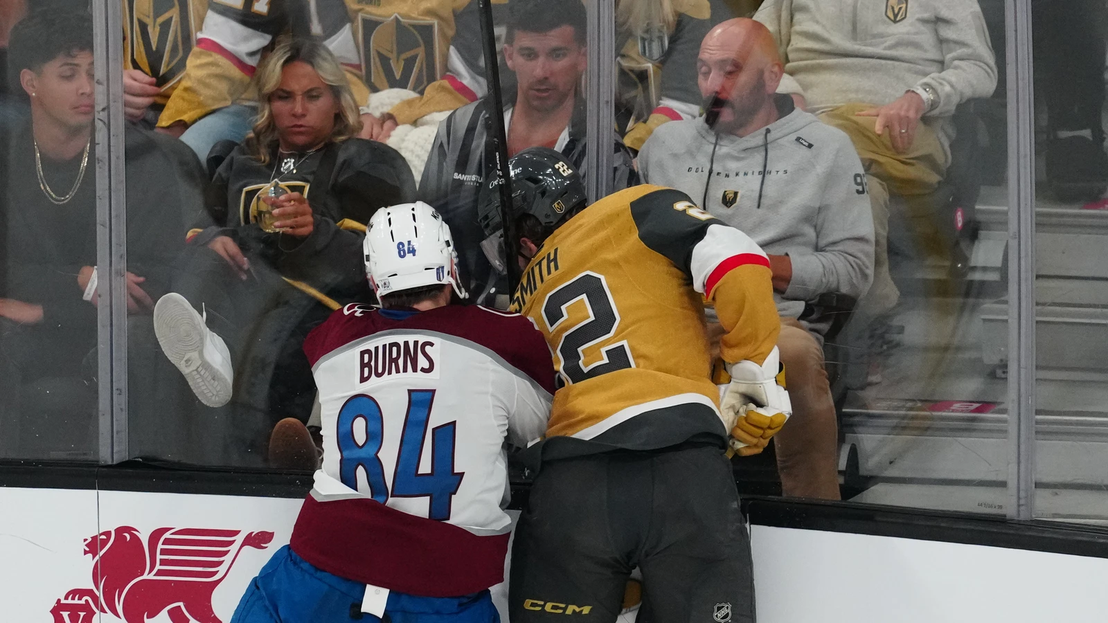 File photo: Colorado Avalanche defenceman Brent Burns checks Vegas Golden Knights winger Cole Smith along the boards during a May 24, 2026 playoff game in Las Vegas.