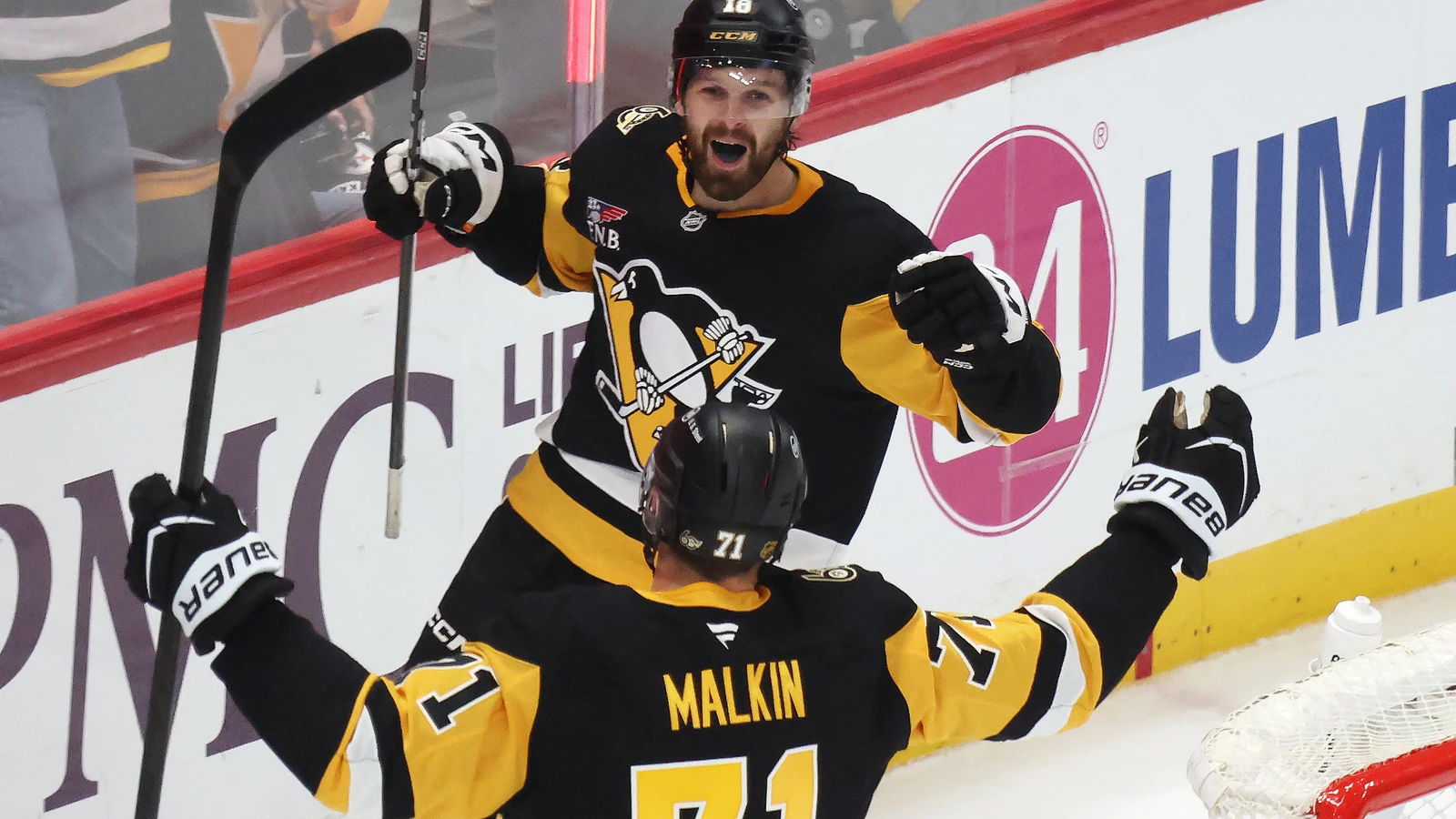 Tommy Novak celebrates with Evgeni Malkin after scoring in overtime against Montreal.