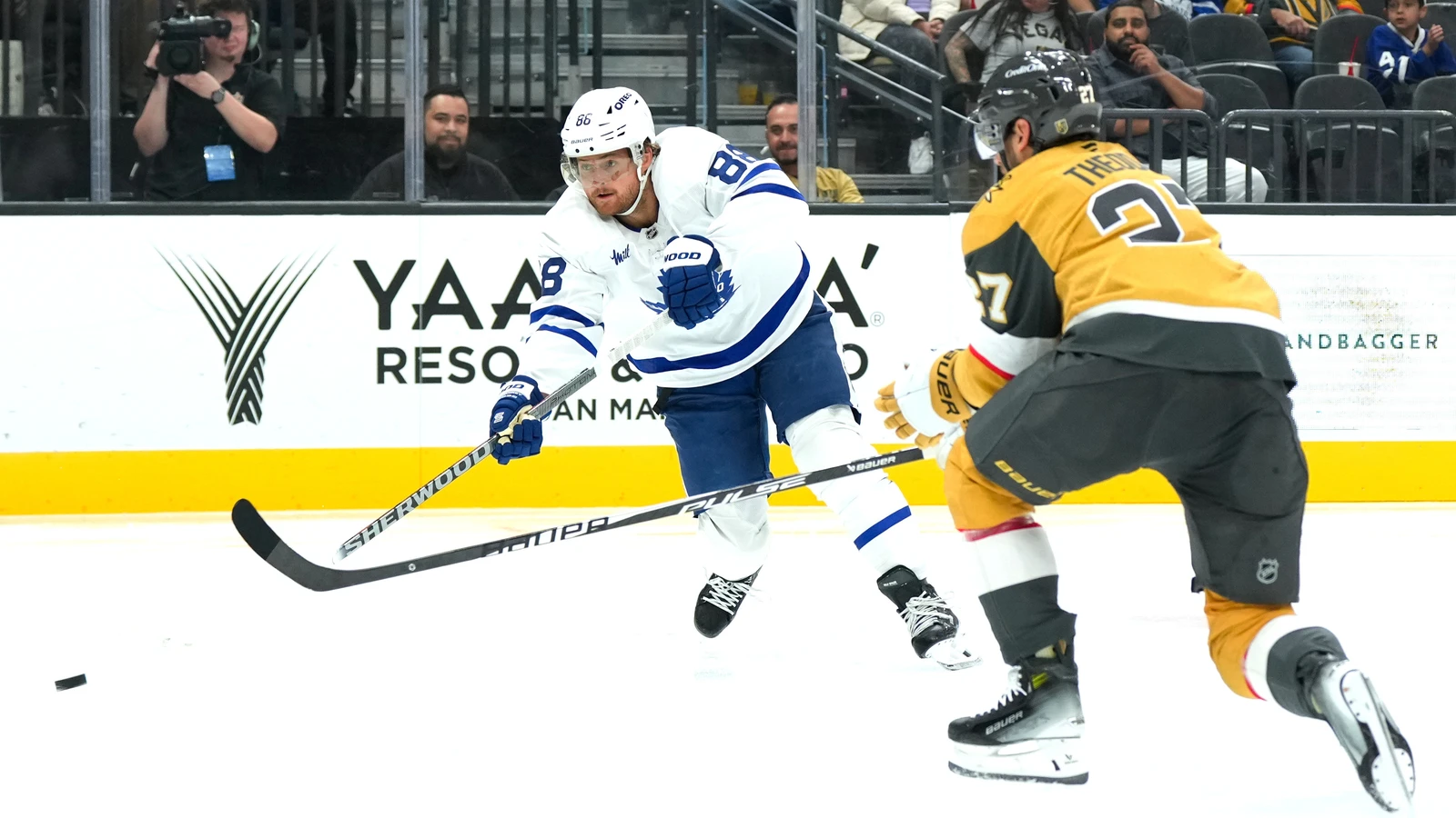 File photo: Toronto Maple Leafs winger William Nylander shoots the puck as Vegas Golden Knights defenceman Shea Theodore closes in.
