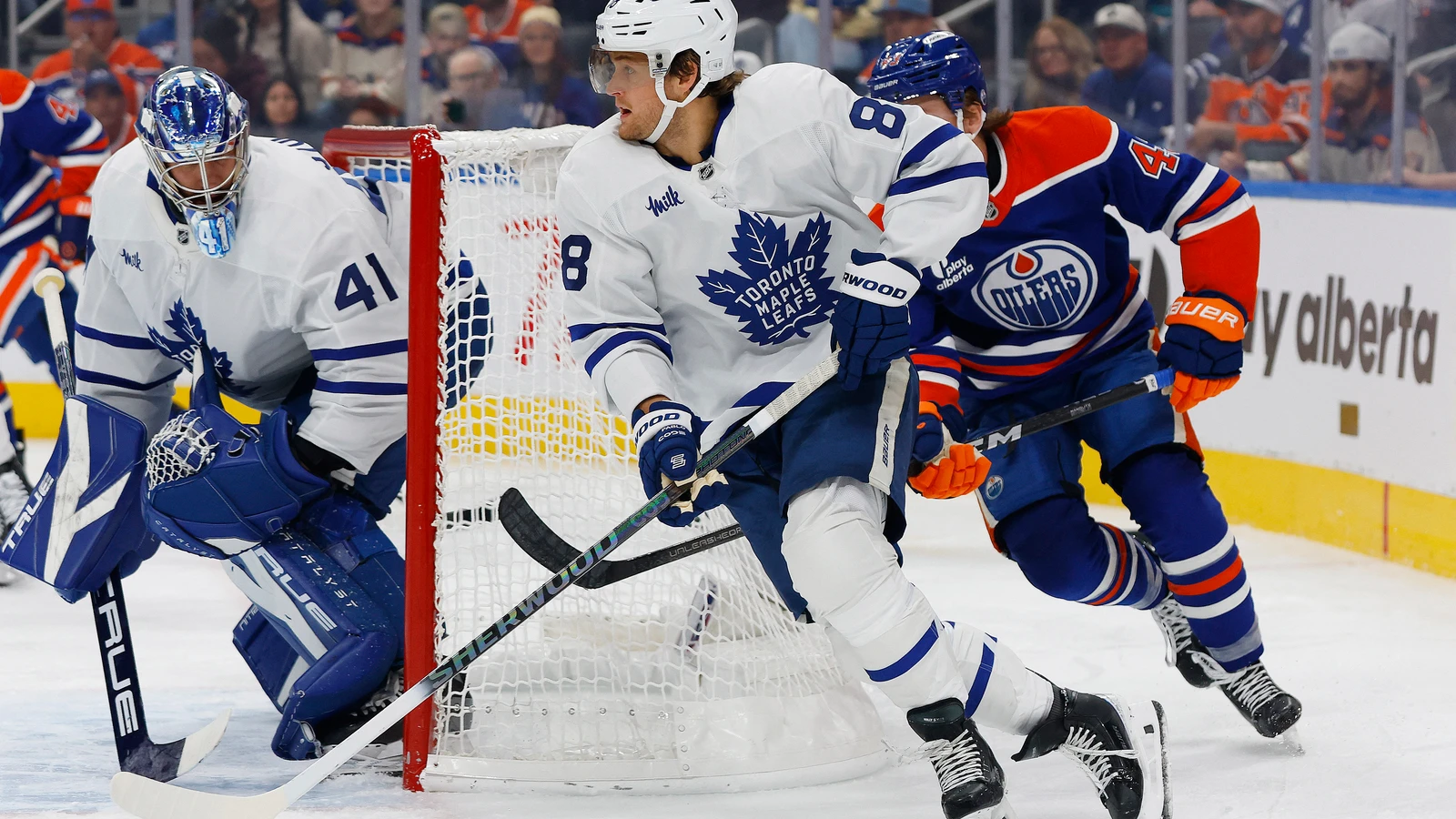 Maple Leafs forward William Nylander looks to pass in front of Oilers forward Owen Michaels during the third period at Rogers Place.