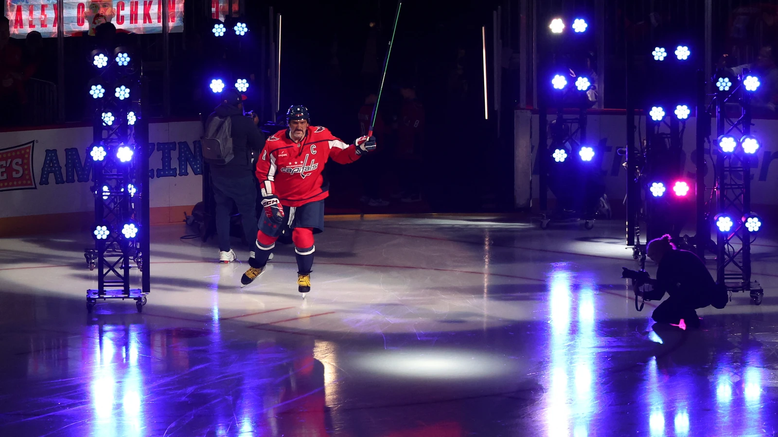 Capitals captain Alex Ovechkin skates onto the ice as he is introduced before his final home opener at Capital One Arena.