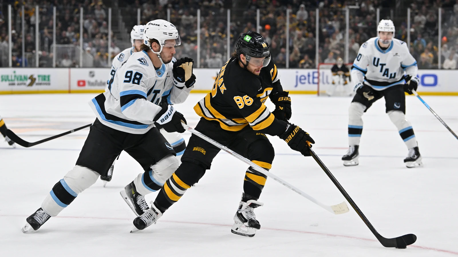 David Pastrnak (88) controls the puck against the Utah Mammoth at TD Garden.