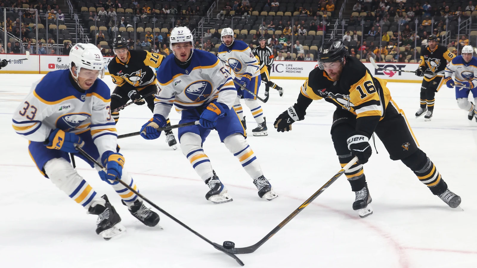 File photo: Ryan Johnson, wearing number 33 for the Buffalo Sabres, battles for the puck against Pittsburgh’s Justin Brazeau.