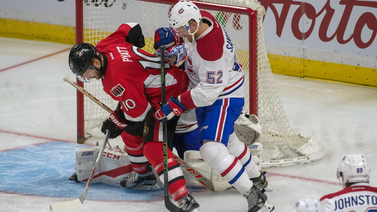 Montreal Canadiens defenseman Philip Samuelsson defends Ottawa Senators forward Tom Pyatt during a preseason game on October 1, 2016. File photo.