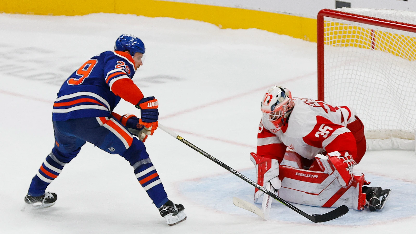 Detroit Red Wings goaltender Michal Postava makes a save against Edmonton Oilers forward Leon Draisaitl during the shootout at Rogers Place.