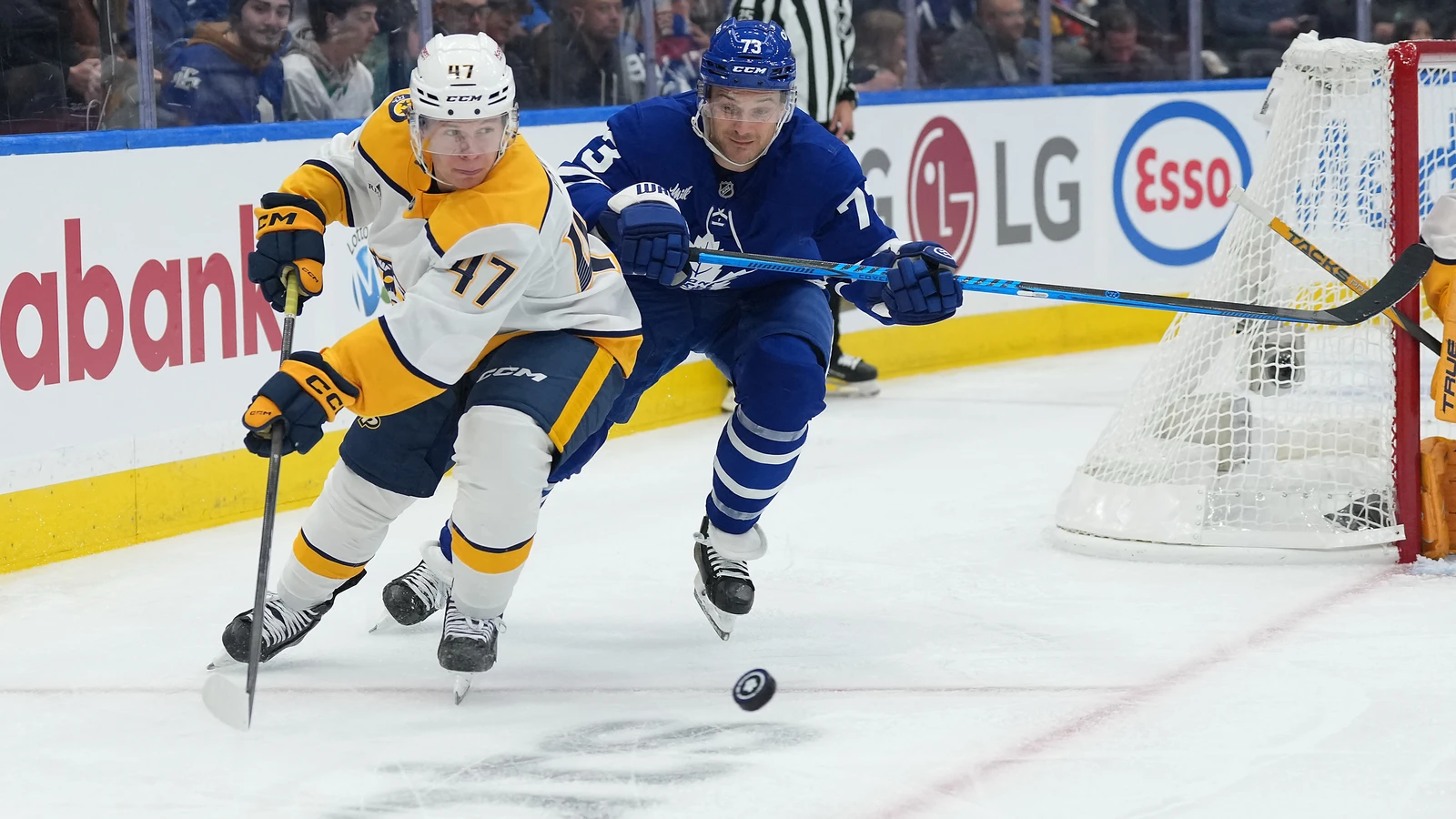 File photo: Nashville Predators defenceman Jack Ahcan controls the puck with Toronto Maple Leafs forward Teddy Blueger pursuing.