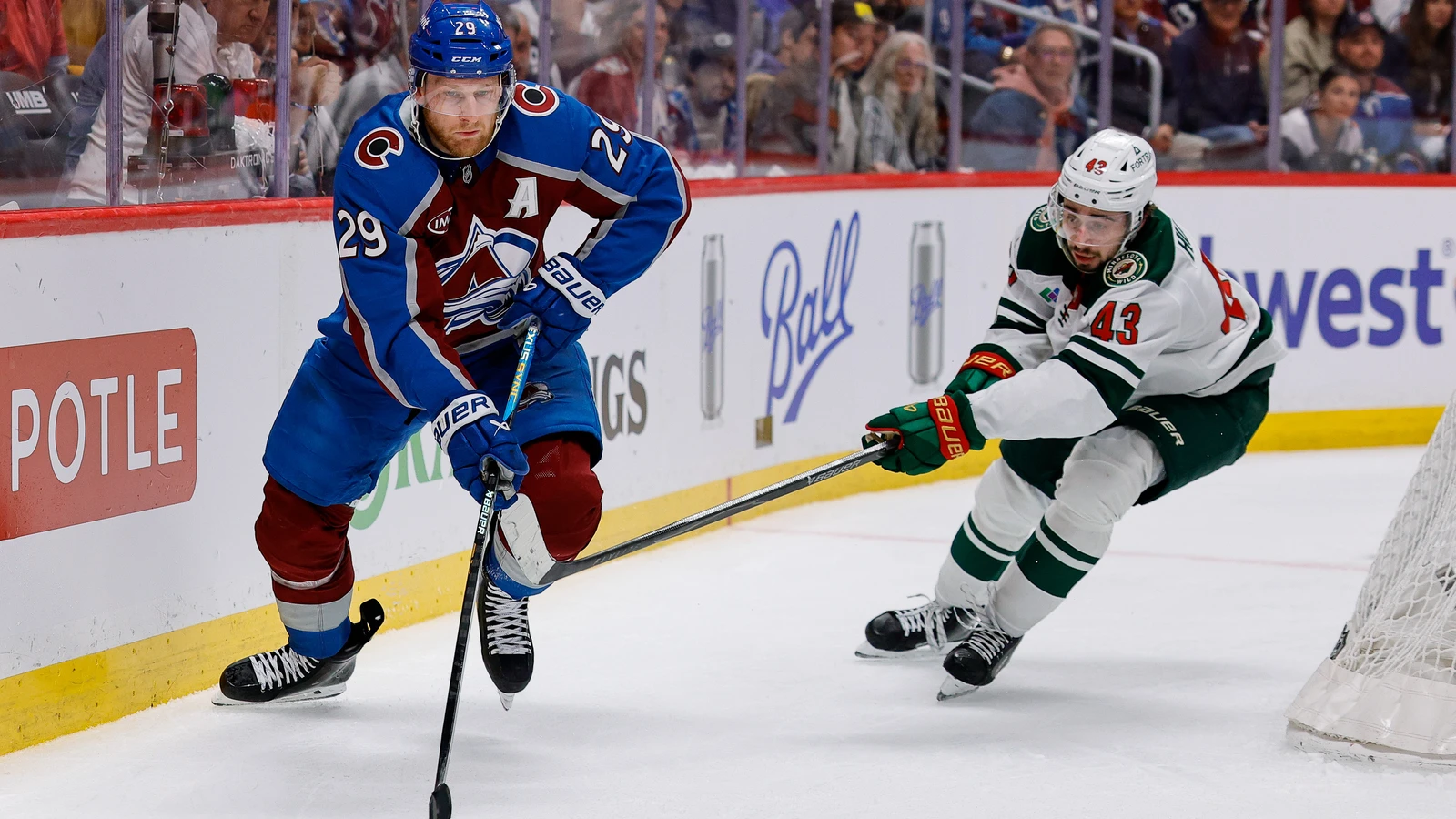 Quinn Hughes defends Nathan MacKinnon for the Minnesota Wild in Denver on May 13, 2026. File photo.