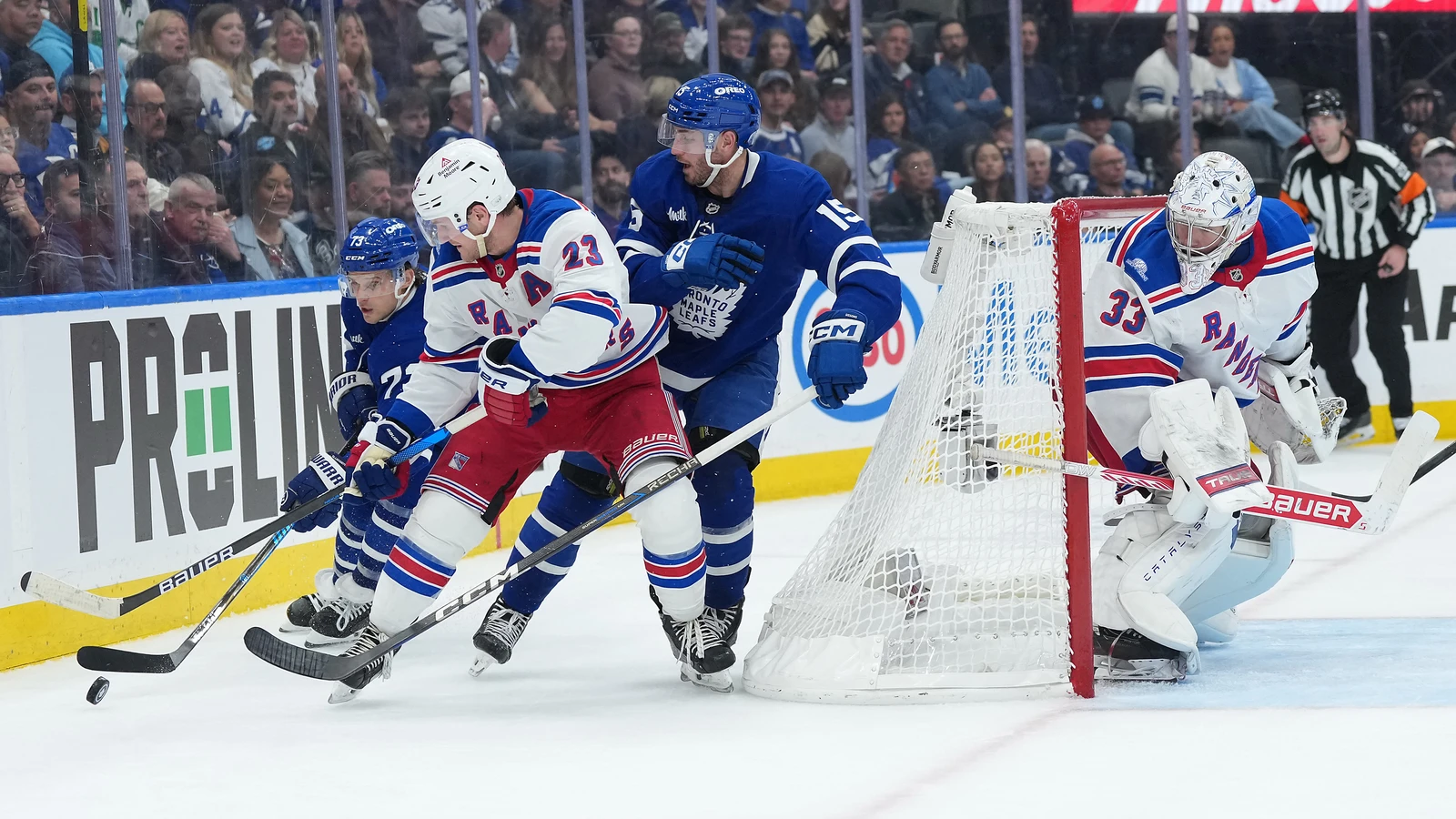 File photo: New York Rangers defenceman Adam Fox battles for the puck beside the net during a game in Toronto.