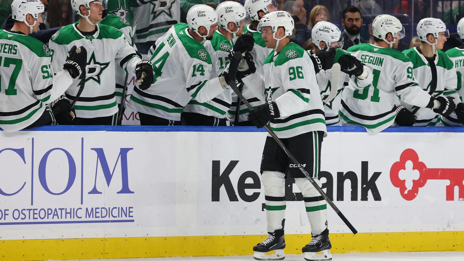 Mikko Rantanen celebrates his goal with Dallas Stars teammates beside the bench.