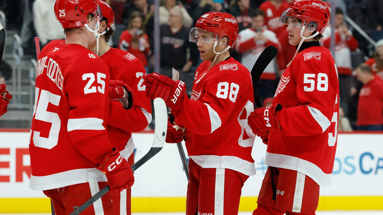 Patrick Kane celebrates with Red Wings teammates during a January 2026 home game. File photo.