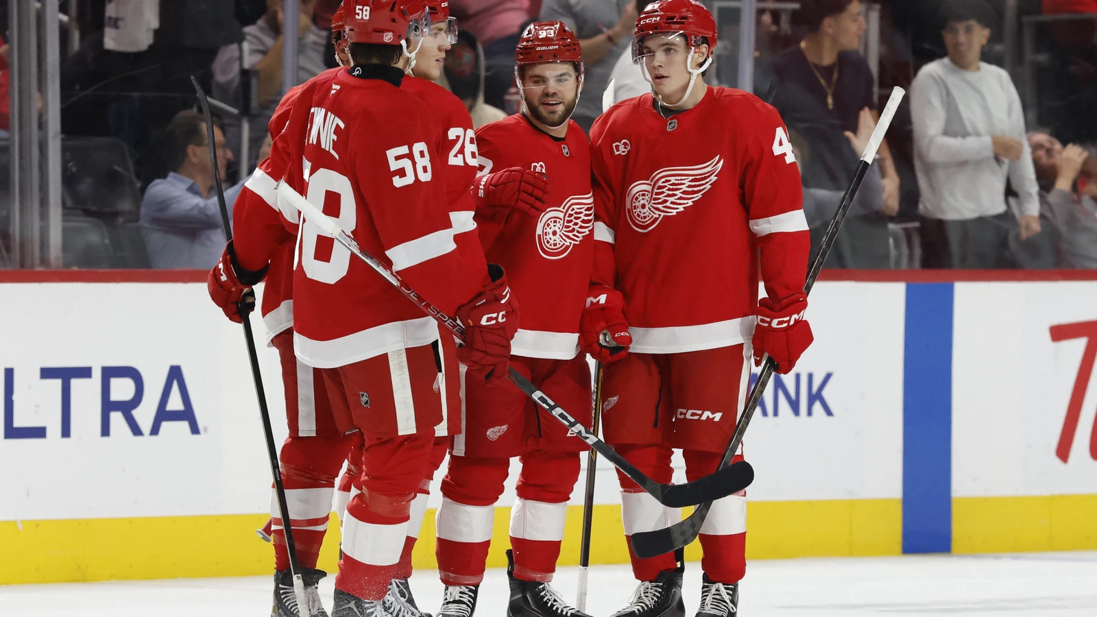 File photo: Alex DeBrincat celebrates with Detroit Red Wings teammates after scoring against the New Jersey Devils.