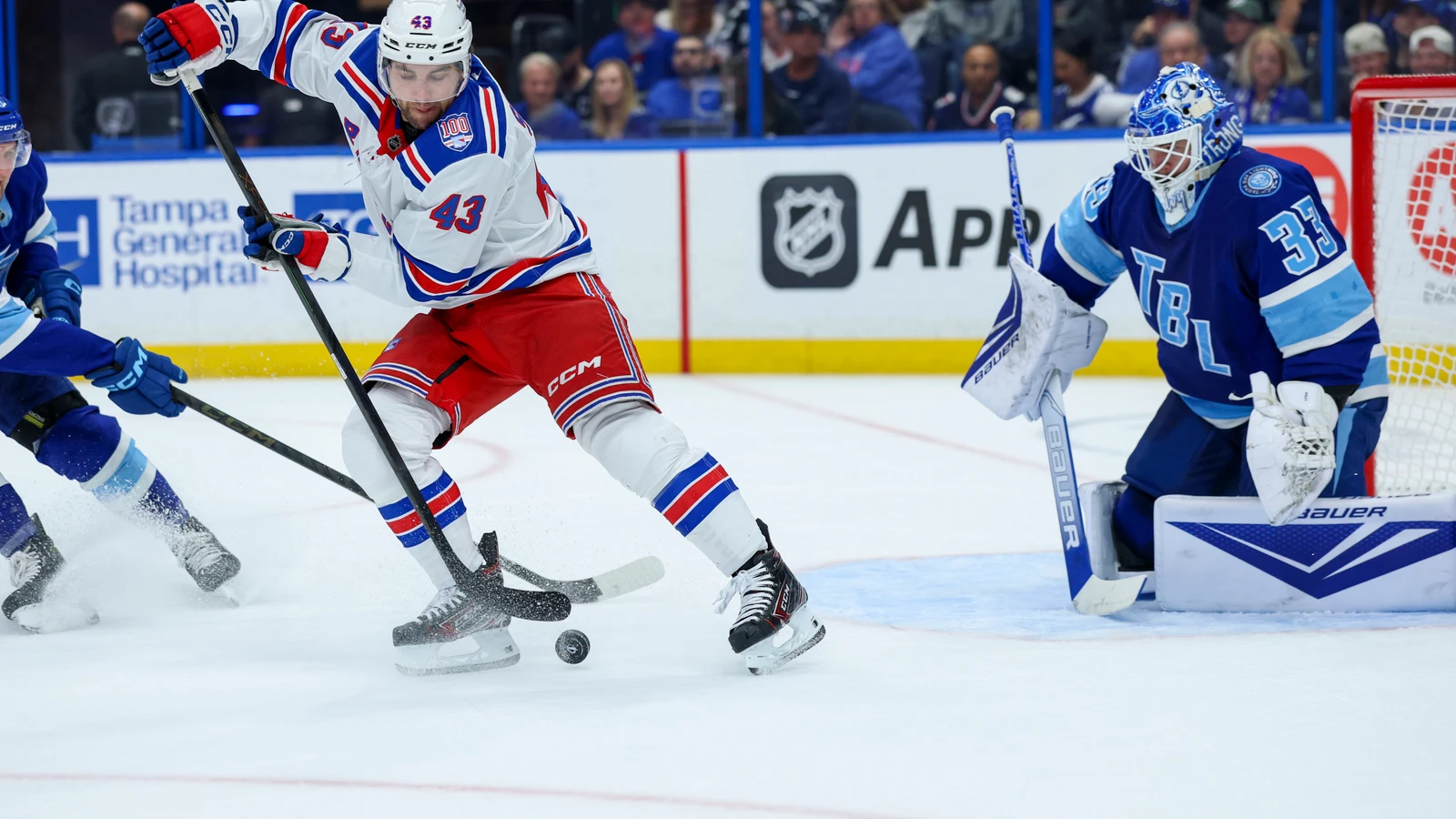 File photo: Conor Sheary, wearing a New York Rangers jersey, shoots the puck against the Tampa Bay Lightning on April 15, 2026.