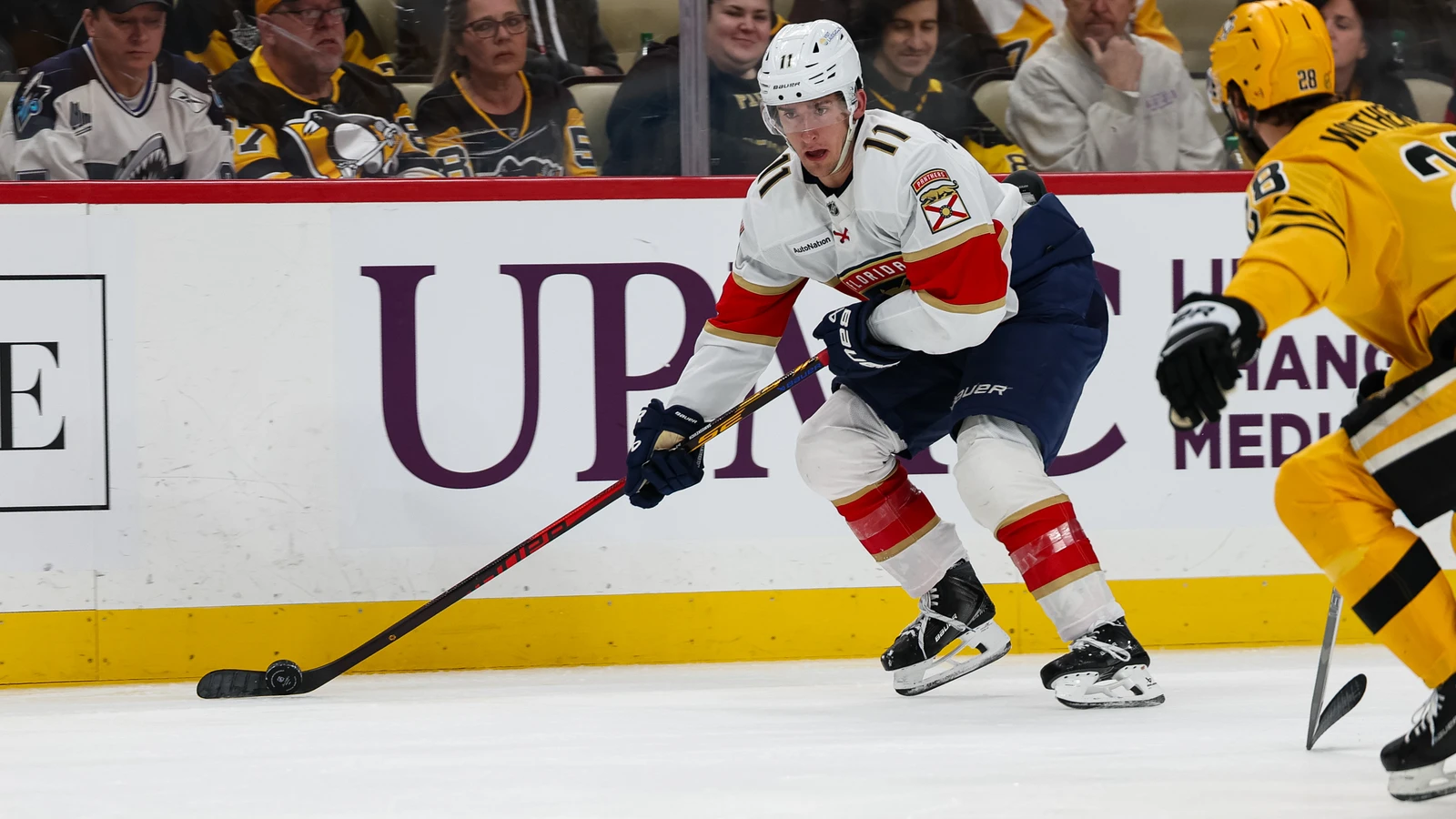 File photo: Mackie Samoskevich controls the puck for the Florida Panthers against Pittsburgh at PPG Paints Arena.