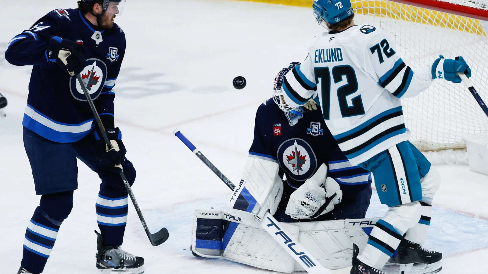 File photo: Eric Comrie, then with the Winnipeg Jets, makes a save against the San Jose Sharks at Canada Life Centre on April 16, 2026.