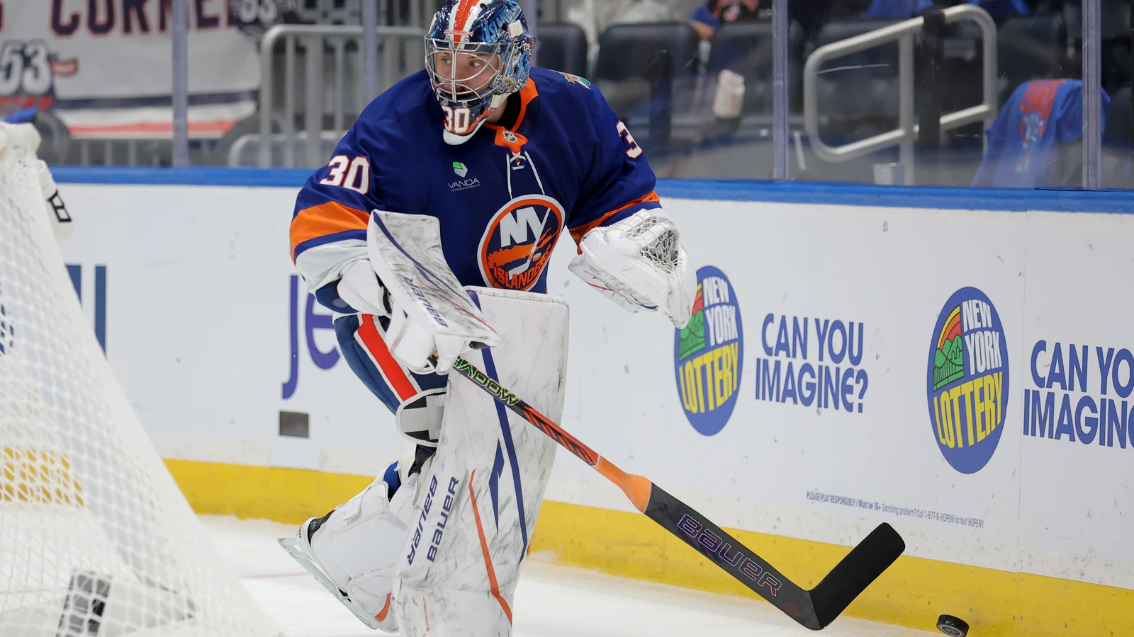 Ilya Sorokin controls the puck beside his net during the Islanders game against the New Jersey Devils at UBS Arena.