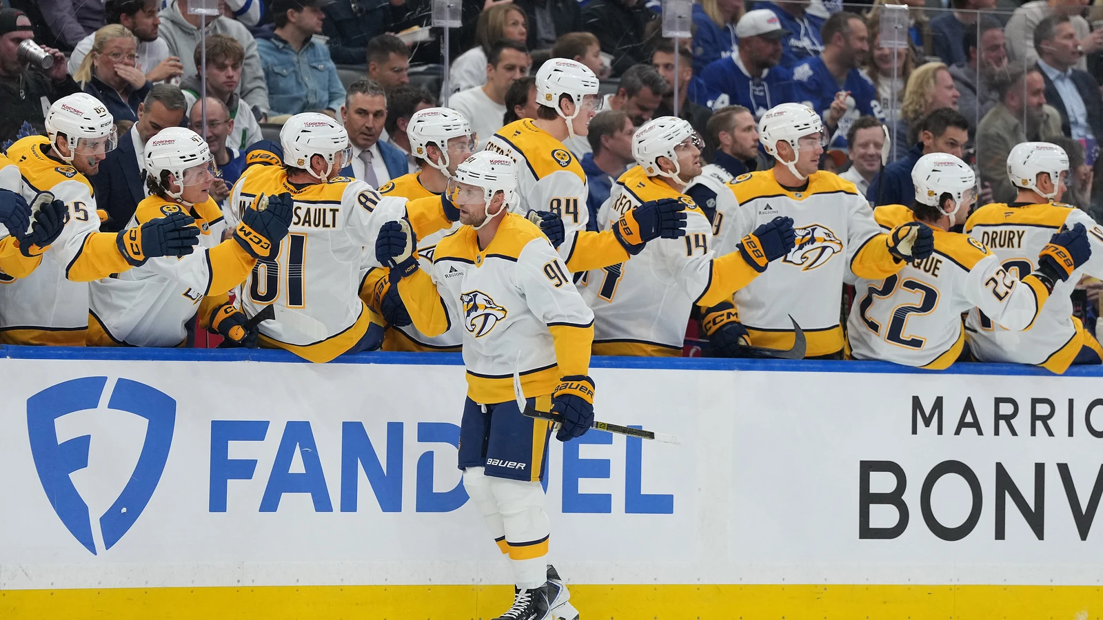 Predators centre Steven Stamkos celebrates with teammates at the bench after scoring against the Maple Leafs in the first period at Scotiabank Arena.