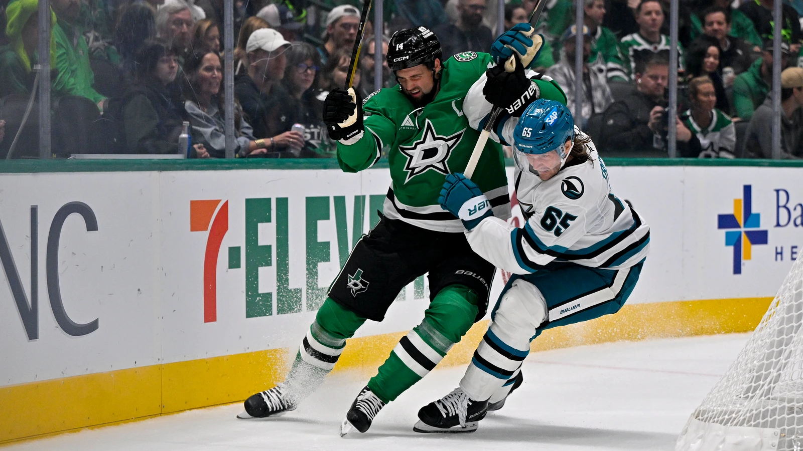 File photo: Dallas Stars forward Jamie Benn battles for the puck alongside a San Jose Sharks defenceman at American Airlines Center.