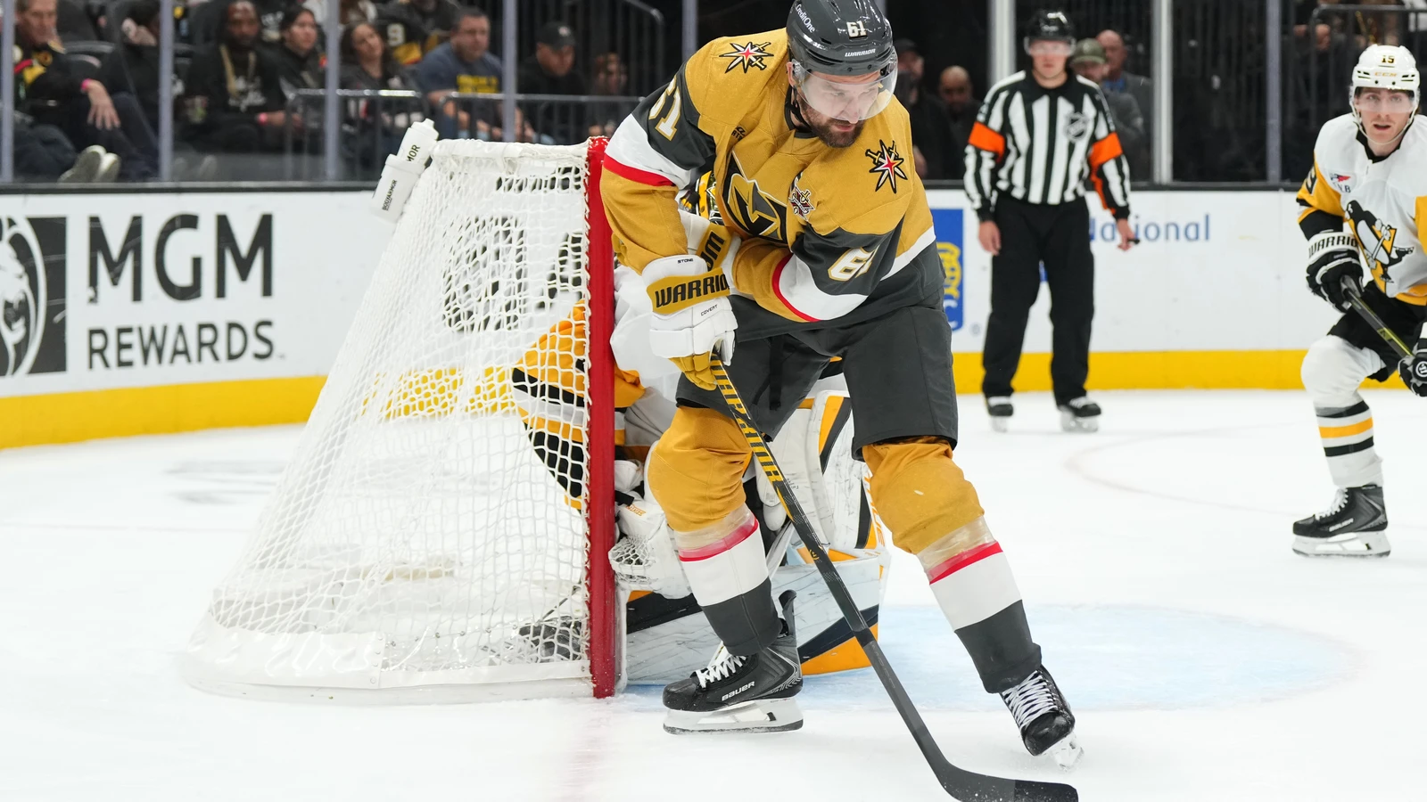 Vegas Golden Knights forward Mark Stone passes the puck against the Pittsburgh Penguins at T-Mobile Arena.