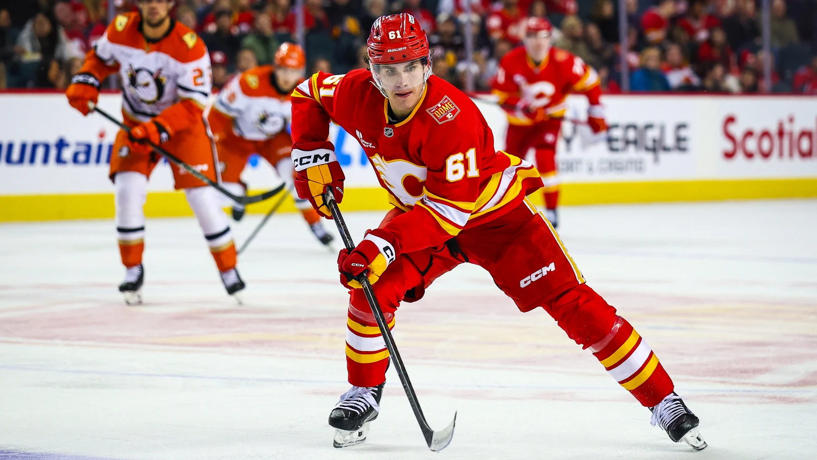 Calgary Flames winger Aydar Suniev skates with the puck against the Anaheim Ducks at Scotiabank Saddledome.