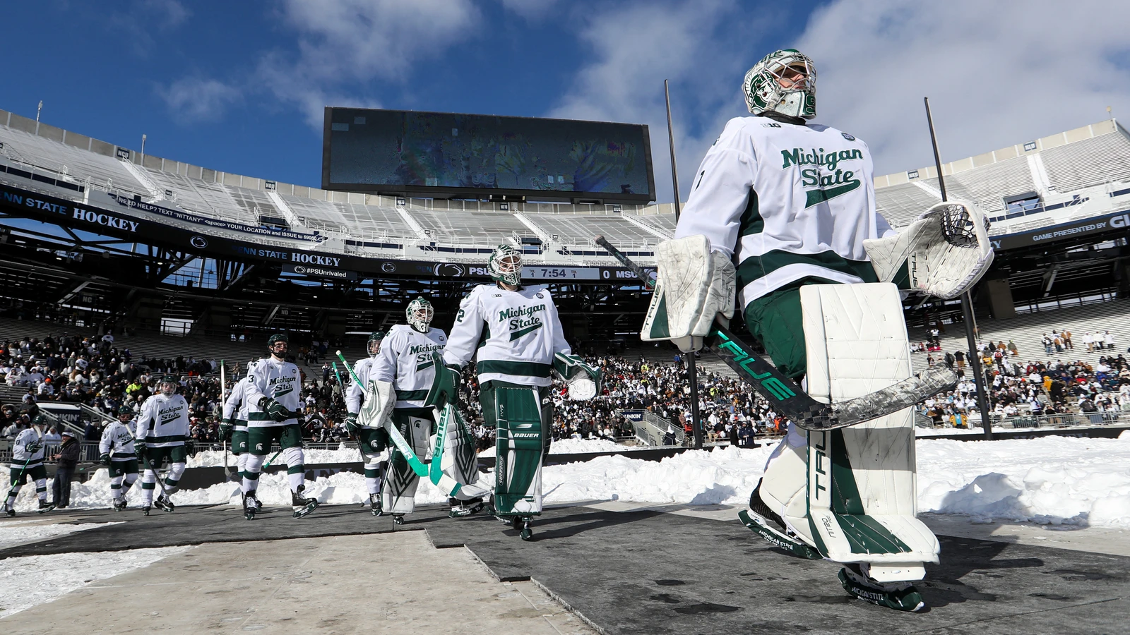 Trey Augustine leads Michigan State onto the ice before facing Penn State at Beaver Stadium on January 31, 2026. File photo.