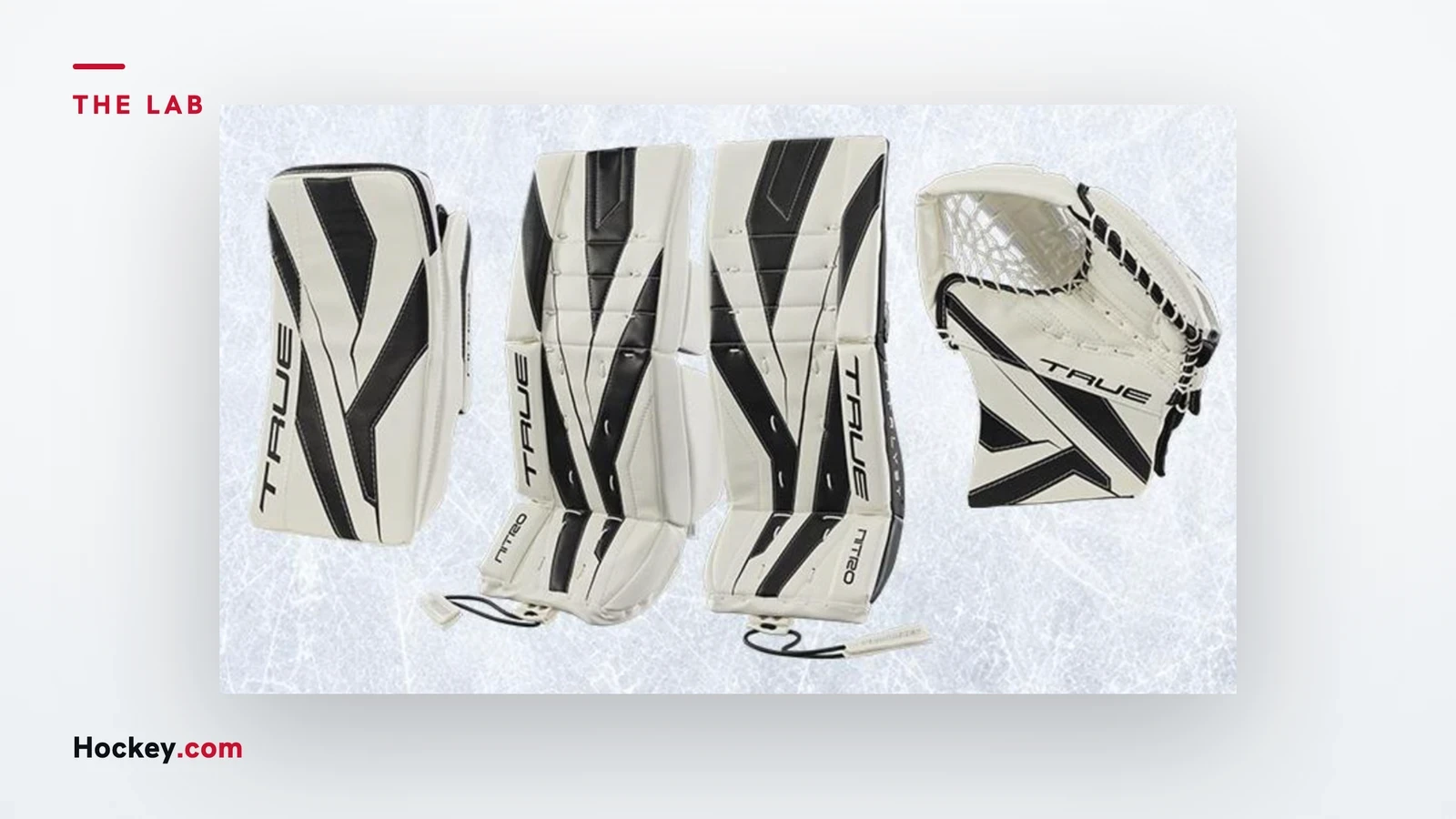 White and black TRUE goalie leg pads, blocker and catcher in an illustrative product photograph.