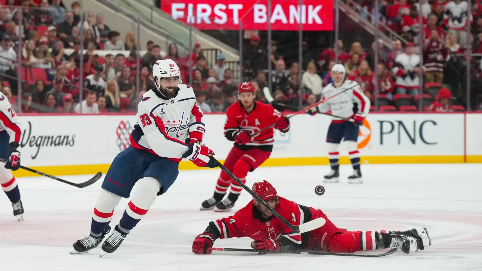Alex Tuch skates with the puck for the Washington Capitals against the Carolina Hurricanes at Lenovo Center.
