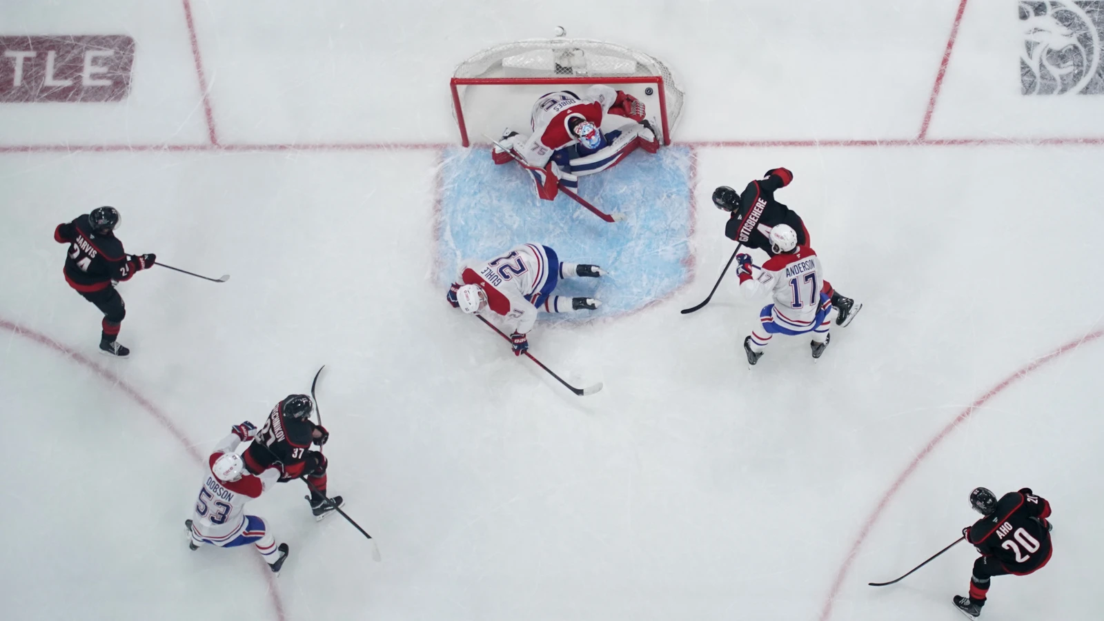 Carolina Hurricanes defenseman Shayne Gostisbehere scores against Montreal Canadiens goaltender Jakub Dobes in a playoff game on May 29, 2026. File photo.