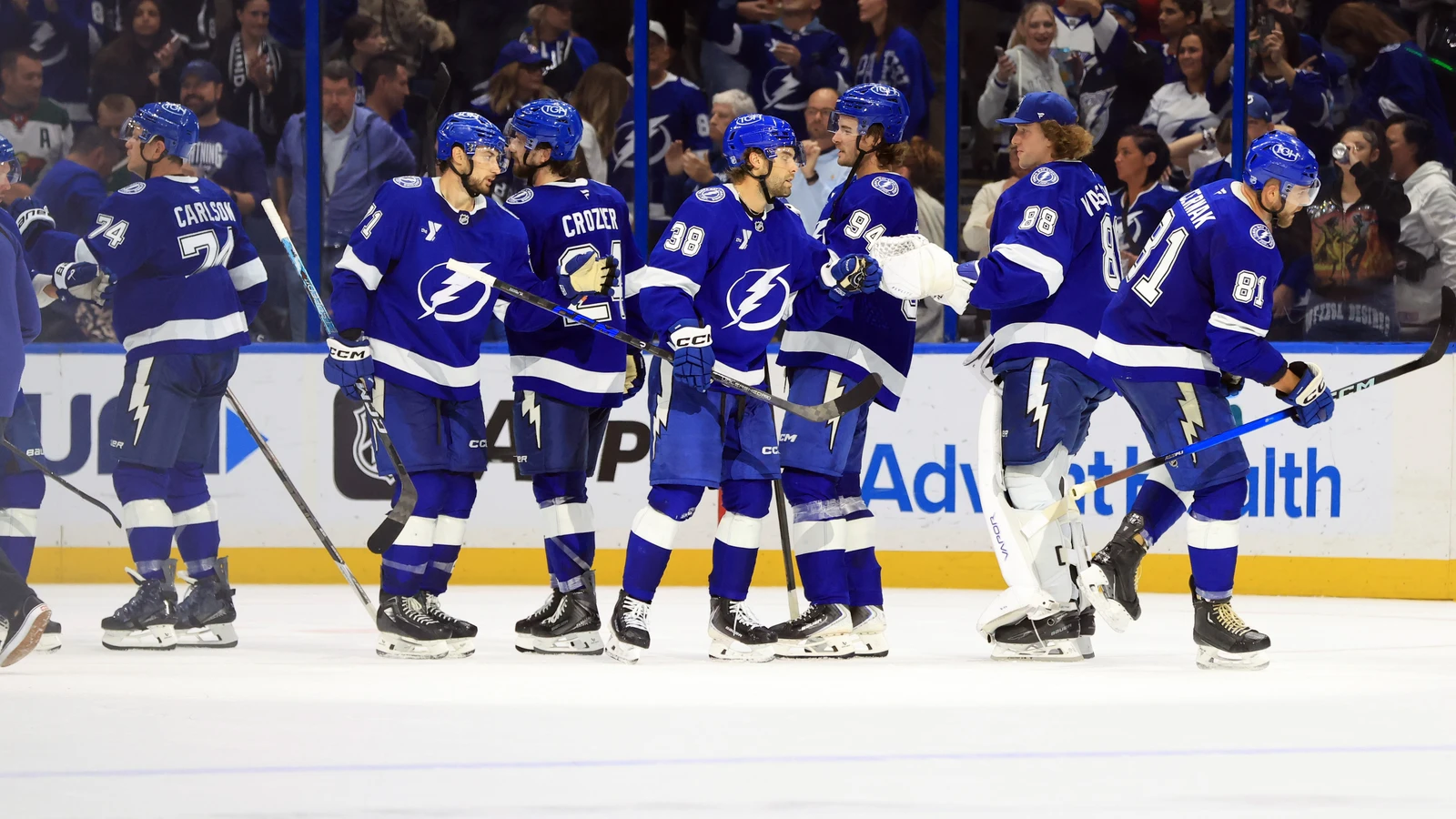 Andrei Vasilevskiy celebrates with Tampa Bay Lightning teammates after a win over Minnesota.