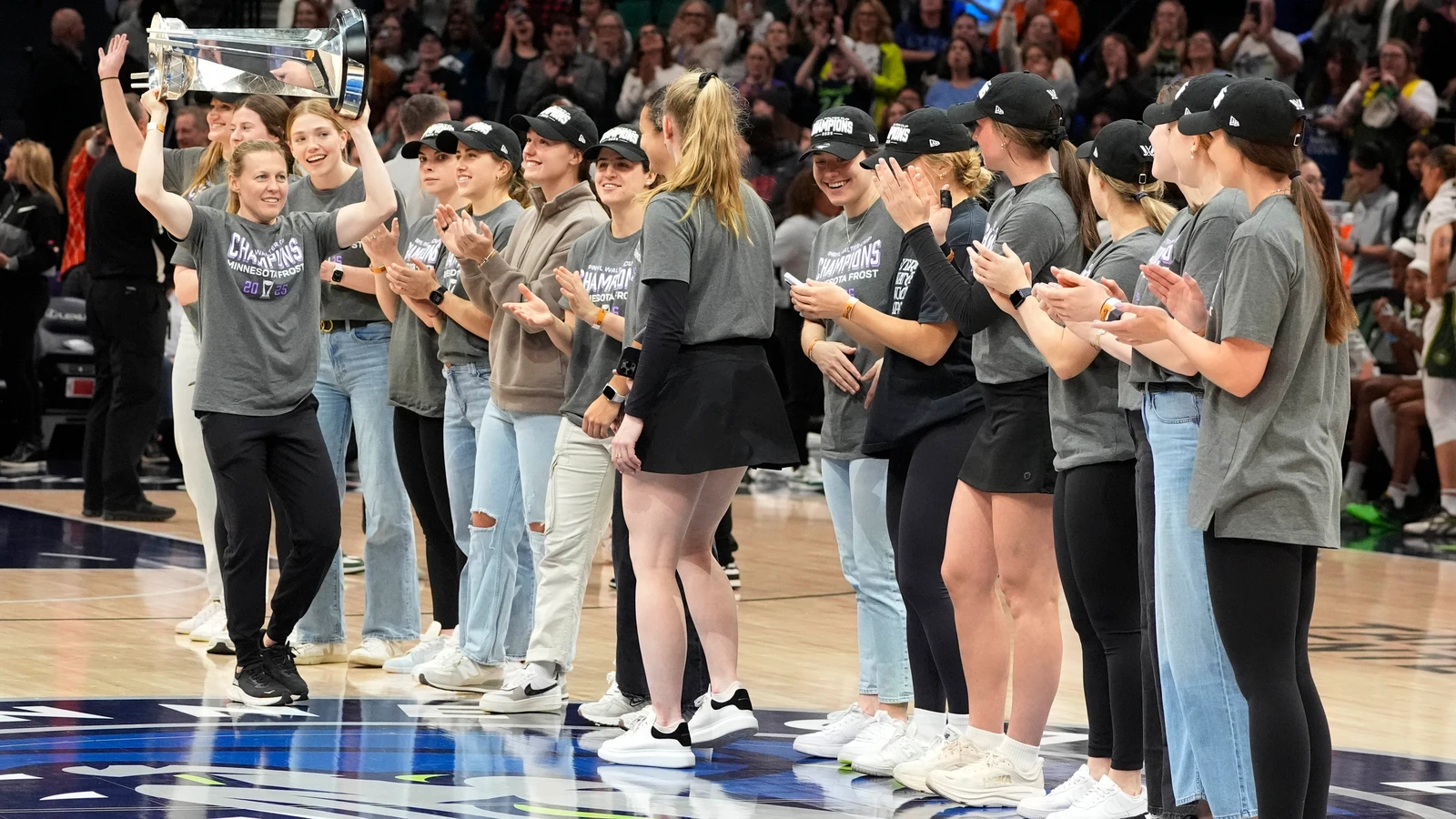 Minnesota Frost captain Kendall Coyne Schofield carries the Walter Cup past teammates at Target Center on May 27, 2025. File photo from a separate presentation; it does not show Shiann Darkangelo’s Brighton event or the missing replica.