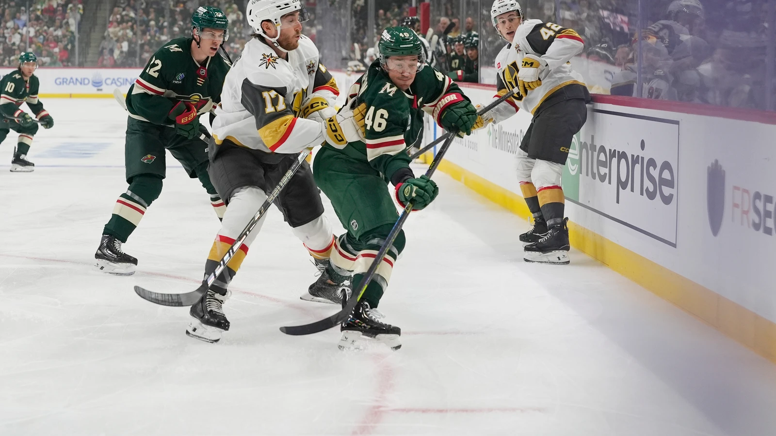 File photo: Minnesota Wild defenceman Jared Spurgeon passes the puck beside Vegas Golden Knights forward Marc Gatcomb.