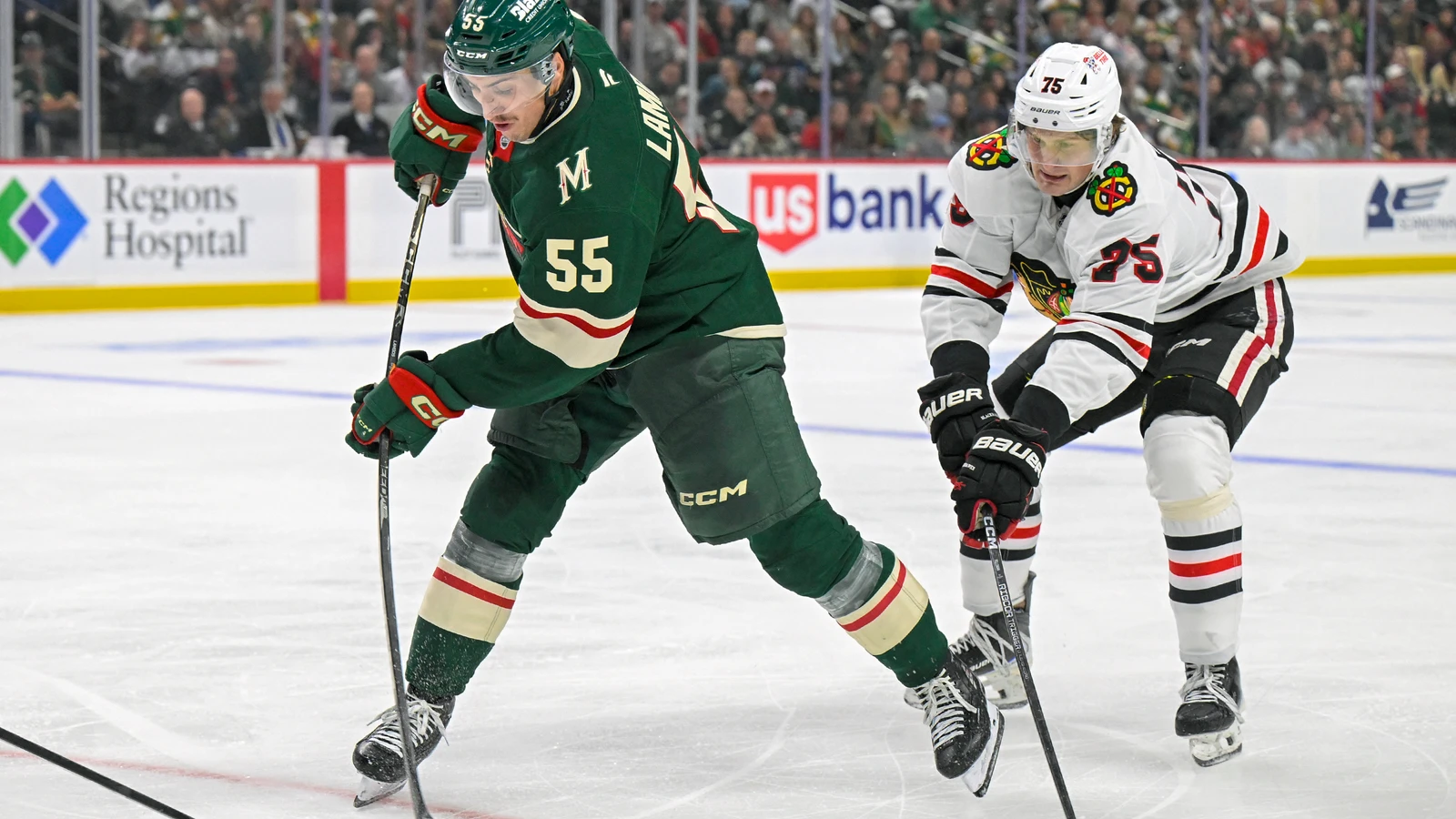 File photo: Wild defenceman Carson Lambos shoots the puck against the Chicago Blackhawks in a preseason game in Saint Paul.
