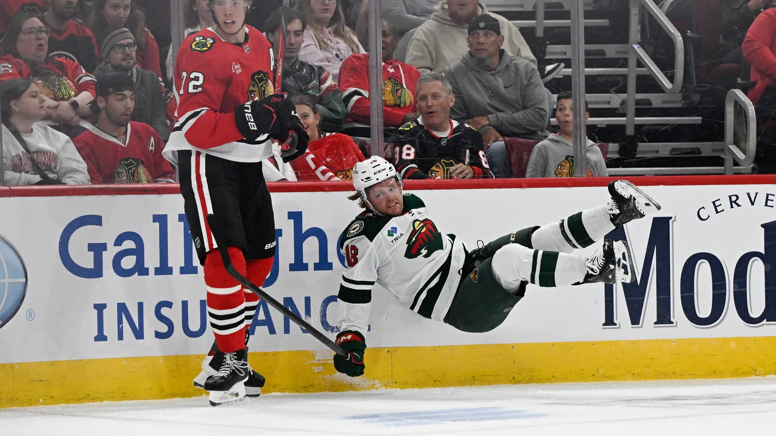 File photo: Minnesota Wild forward Mason Shaw falls onto the ice beside Chicago Blackhawks centre Sacha Boisvert during a pre-season game in Chicago on Sept. 21, 2026.