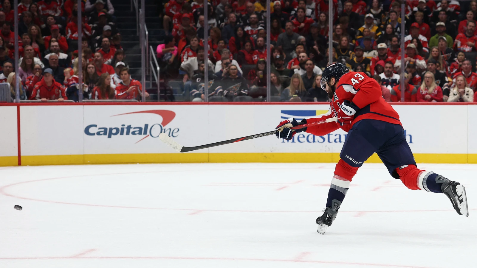 Tom Wilson (43) takes a shot during the first period against the Pittsburgh Penguins at Capital One Arena.