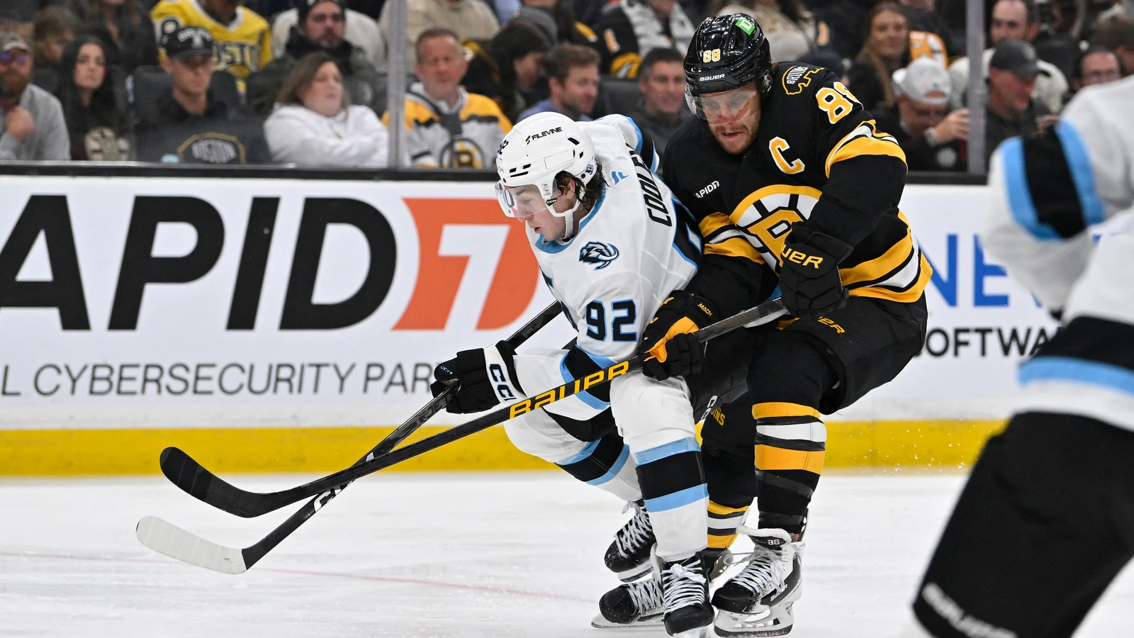File photo: Boston Bruins captain David Pastrnak battles for the puck against the Utah Mammoth at TD Garden.
