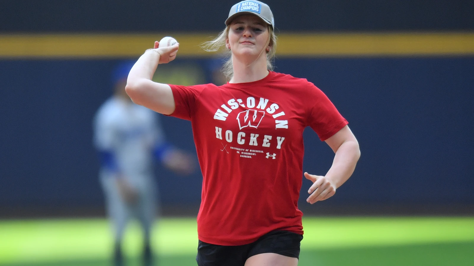 Wisconsin goaltender Ava McNaughton throws a ceremonial first pitch in Milwaukee in July 2025. File photo.